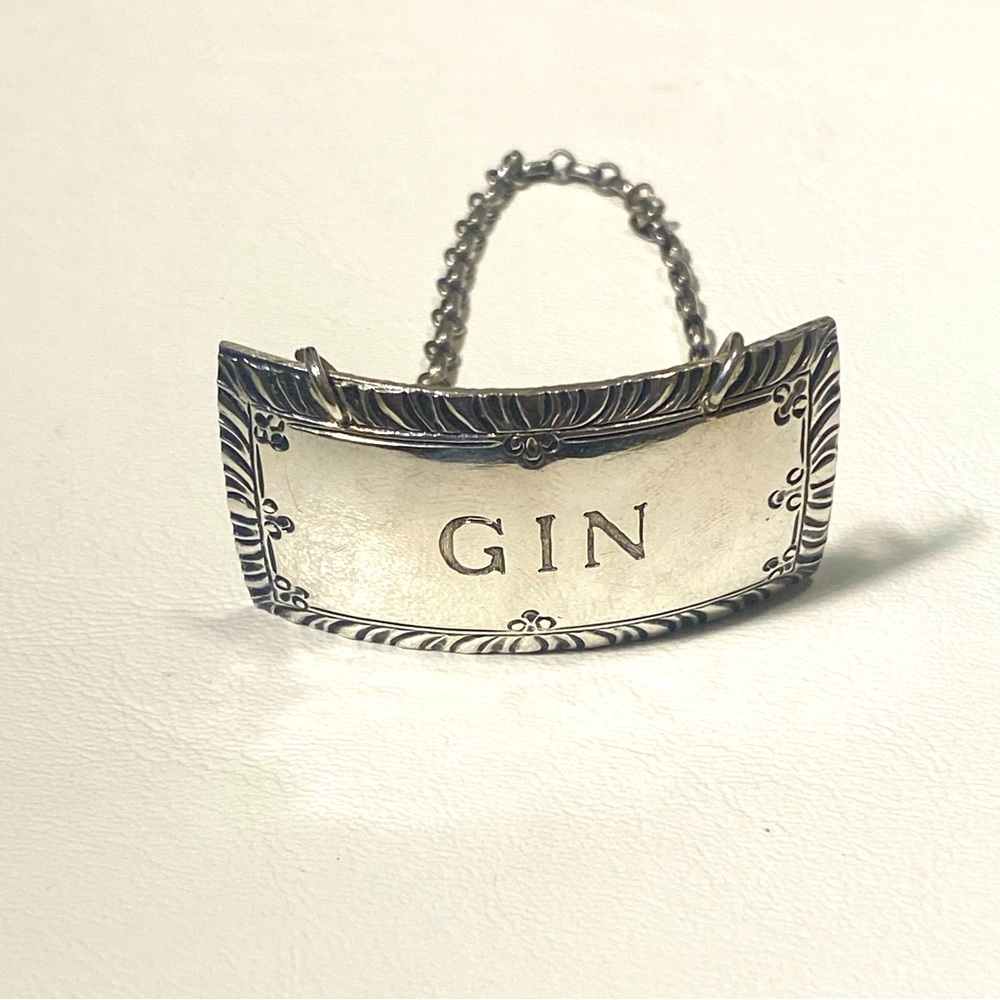 Stieff sterling silver liquor decanter hang tag.